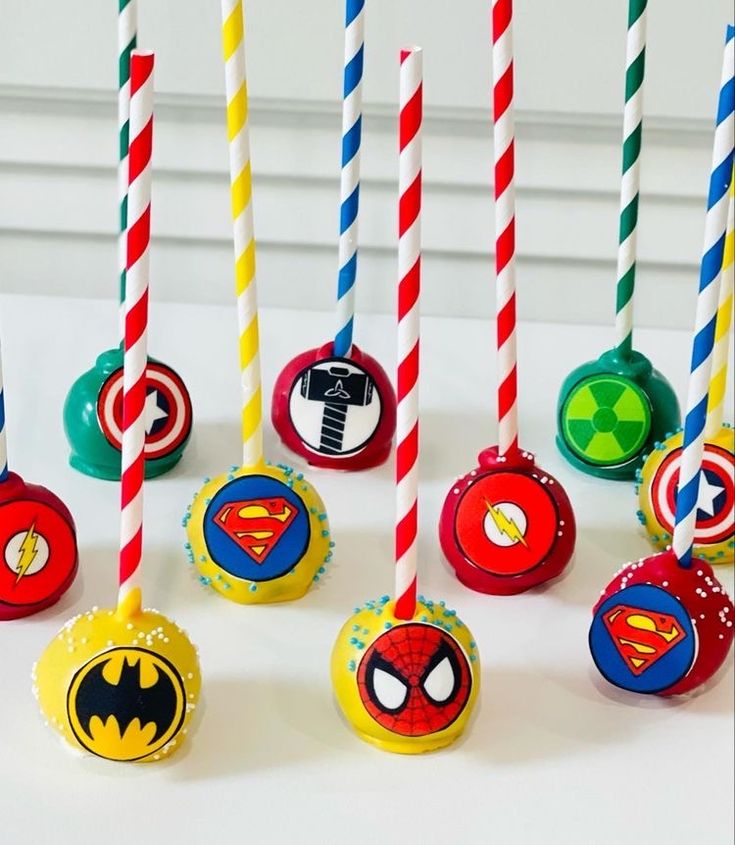 there are many birthday candles that have different designs on them, including batman and spiderman