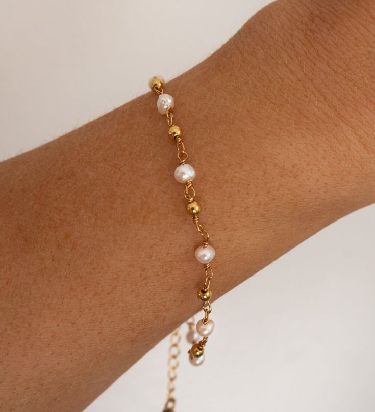 Gold Plated and Freshwater Pearl Beaded Chain Bracelet Real Freshwater Pearls Length: approx. 6 - 8 inches (adjustable) 18 Gold Electroplated This bracelet is made with a real freshwater pearls, therefore each pearl is unique and no two bracelet are alike. White Pearl Bracelets With Adjustable Chain, White Pearl Bracelet With Adjustable Chain, Adjustable Pearl White Bracelets With Pearl Chain, Adjustable Pearl White Bracelet With Pearl Chain, Adjustable Beaded Pearl Bracelet As Gift, Pearl Chain Bracelets, Adjustable Pearl Bracelet With Pearl Chain, Dainty Pearl Bracelet With Adjustable Beaded Chain, Elegant Pearl Bracelet With Beaded Chain