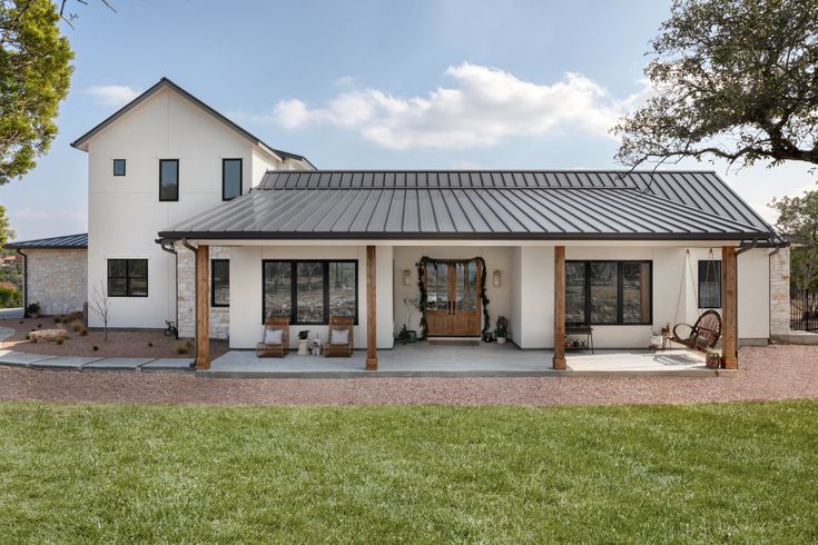 a large white house with a metal roof