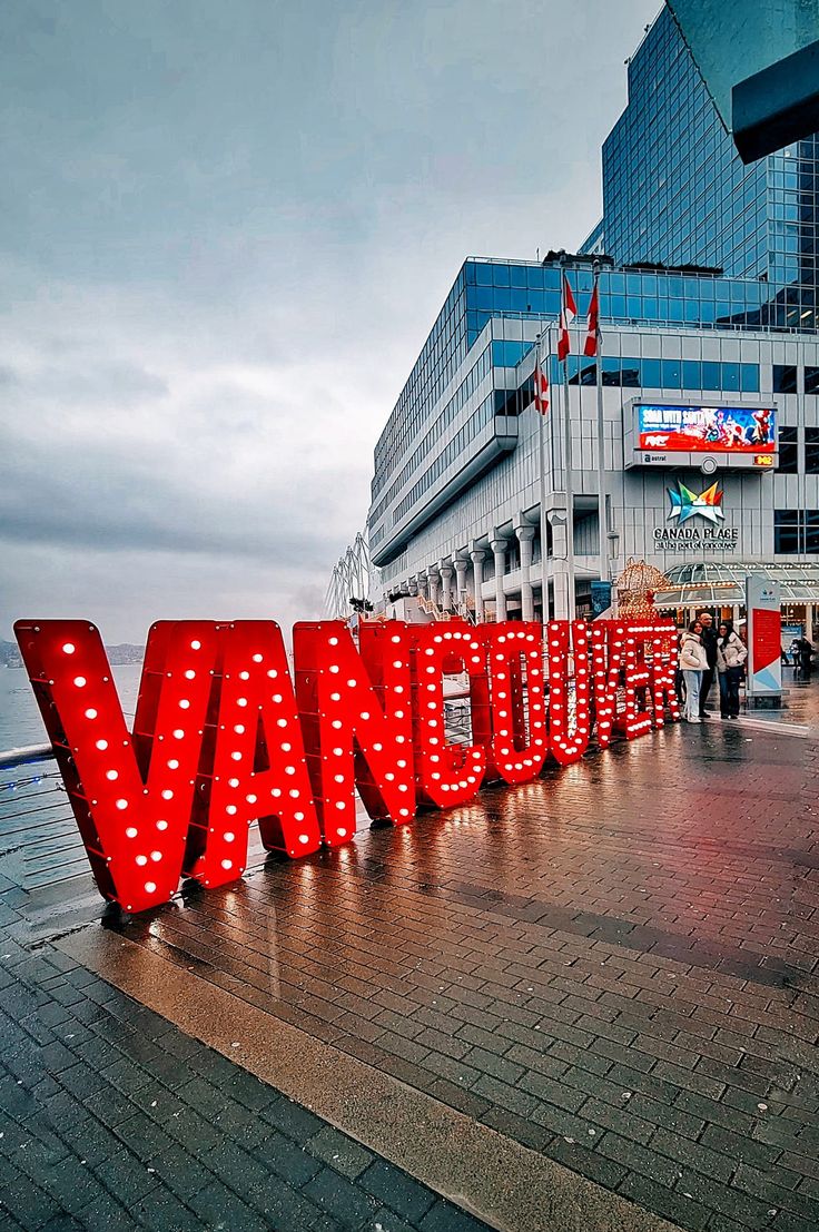 a large red sign that says vancouver on it