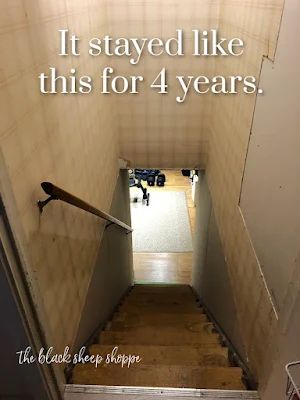 Basement stairwell in need of renovation. Basement Stair Entryway Ideas, Open Stair To Basement, Basement Stairs Entrance, Opening Up Basement Staircase Wall, Hallway To Basement Ideas, Basement With Wallpaper, Basement Door Under Stairs, Basement Stairway Decorating Ideas, Basement Hallway Decor