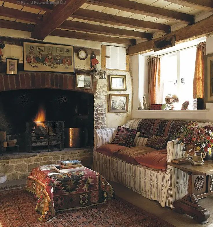 a living room filled with furniture and a fire place