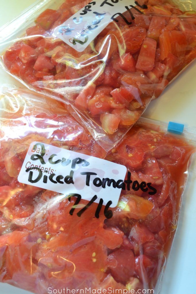 two bags of diced tomatoes sitting on top of a table