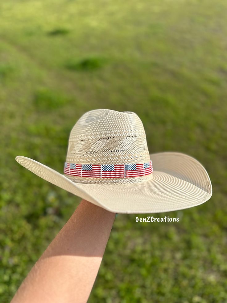 The USA Hatband is a stylish and patriotic accessory that adds a touch of flair to any hat. Hand-beaded with precision, this hatband represents American pride and heritage. Show off your love for the USA with this unique addition to your wardrobe. Whole Hatband - 35 inches Beaded Portion - 20 inches Adjustable Southern Style Hat Bands For Country Events, Custom Adjustable Summer Hat Bands, Adjustable Red Hat Bands For Kentucky Derby, Patriotic Adjustable Hat For Independence Day, Adjustable Americana Hat For 4th Of July, White Americana Hat With Adjustable Fit, Red Adjustable Hat Bands For Country Events, White Adjustable Americana Hat, Red Adjustable Country Hat Bands