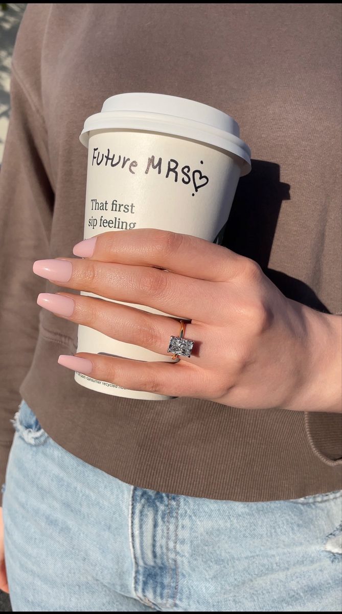 a woman's hand holding a coffee cup with the words future mrso on it