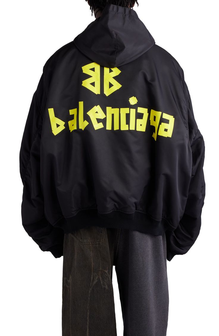 Balenciaga's streetwear-ready aesthetic is on display with this oversized, hooded bomber jacket branded with taped-up logo lettering for a DIY vibe. 29" length (size 2) Two-way front-zip closure Fixed hood Ribbed cuffs and hem Front welt pockets; sleeve utility pocket Lined, with silk/polylactide fill 100% polyamide Hand wash, line dry Made in Italy Designer Clothing Clothing Tape, Black Balenciaga, Designer Clothing Brands, Balenciaga Black, Balenciaga Designer, Jacket Brands, Jacket Design, Ski Jacket, Red Jacket