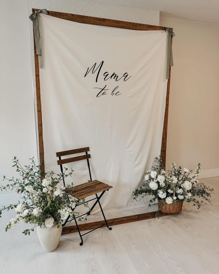 a chair sitting in front of a white backdrop with the word menu to be written on it