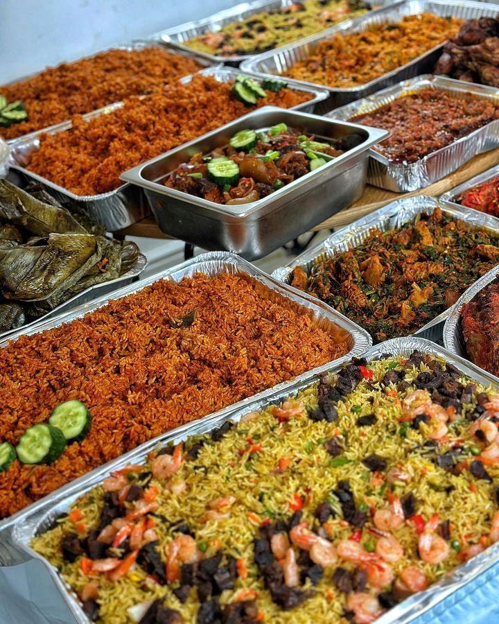 many trays filled with different types of food on top of a table next to each other