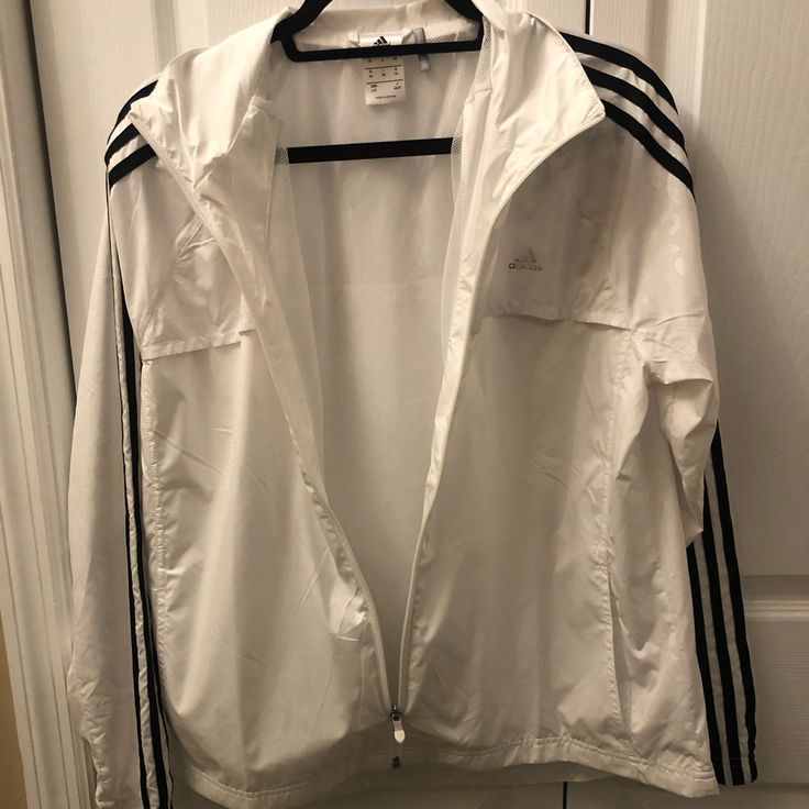 Nwot. White Adidas Windbreaker Jacket. Never Worn. Nice Reflective Design On The Top Of The Jacket. Super Soft And Great Quality. Size Large. Adidas Windbreaker Jacket, White Adidas Windbreaker For Spring, Adidas White Track Jacket For Fall, Adidas White Windbreaker For Sports, Adidas White Outerwear For Spring, White Adidas Outerwear For Spring, Adidas Casual White Track Jacket, Casual White Adidas Track Jacket, White Long Sleeve Sports Outerwear