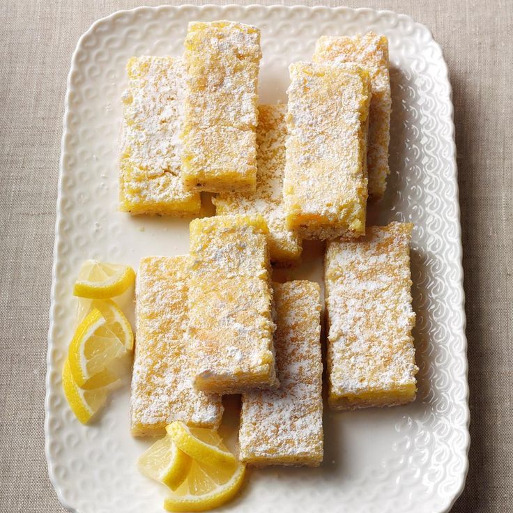 several pieces of lemon cake on a white plate