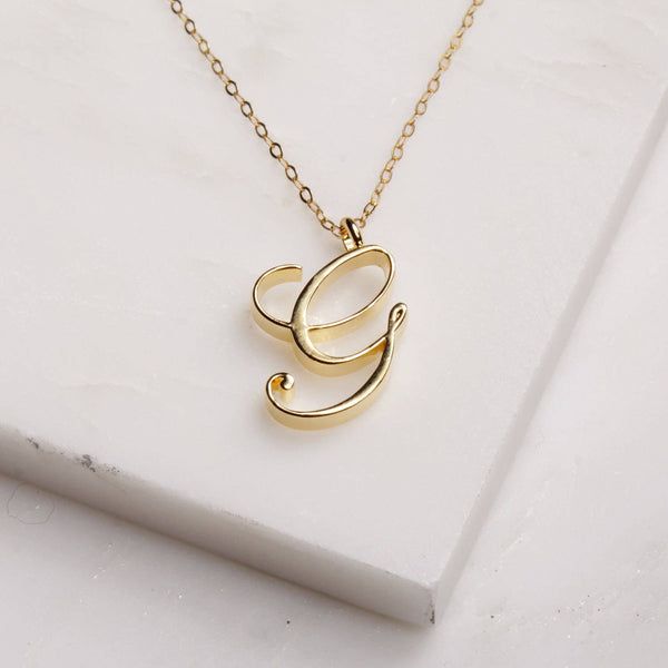 G Initial Necklace - Cursive "G" initial gold pendant - Personalized initial gold pendant for women / Gift for her / for mom / for wife / Dainty "G" initial. Perfect every day necklace. Lovely gift for your self, sister, bridesmaids, new mom. Pendant: Base metal is brass and 14K gold plated. Chain is 18 inches, 14k gold filled Note: model shots might show a different initial, only to illustrate overall look and length of the chain. This listing is for the "G" initial. Cheap Initials Pendant Necklace, Cheap Initial Necklaces For Gifts, Cheap Initials Necklaces For Gifts, Cheap Initial Letter Necklace As Gift, Cheap Adjustable Initial Pendant Necklace, Cheap Gold Monogram Initial Necklace, Cheap Initials Necklace Gift, Affordable Elegant Initial Necklace With Adjustable Chain, Affordable Elegant Yellow Gold Initial Necklace