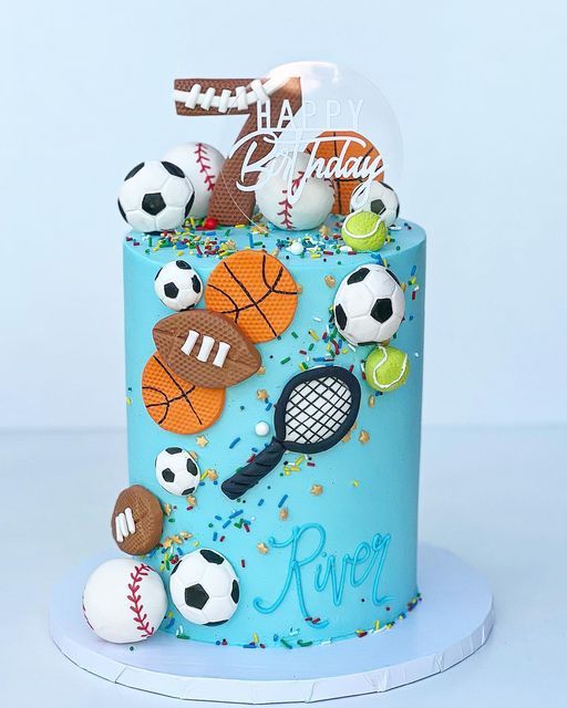 a birthday cake decorated with sports related items