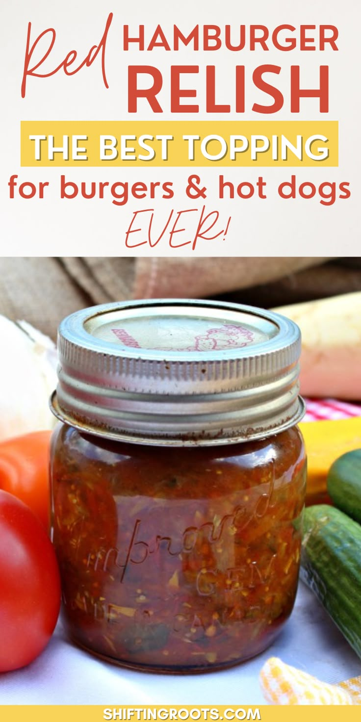 a jar filled with pickles and hot dogs on top of a table next to vegetables