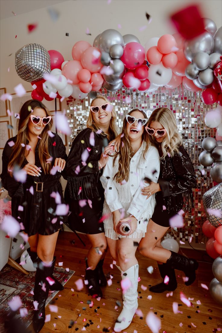 bachelorette party inspo, decor inspo, bachelorette themes, bachelorette, disco cowgirl bachelorette, nashville Tennessee bachelorette, disco tile backdrop, bachelorette photoshoot, girls standing in front of balloons popping confetti for a bachelorette weekend, pink balloons, silver balloons, cowprint balloons, disco ball balloons Disco Cowgirl Bachelorette Party, Destination Bachelorette Party, Disco Cowgirl Bachelorette, Austin Bachelorette Party, Destination Bachelorette, Bachelorette Party Planner, Cowgirl Bachelorette Party, Nola Bachelorette, Austin Bachelorette