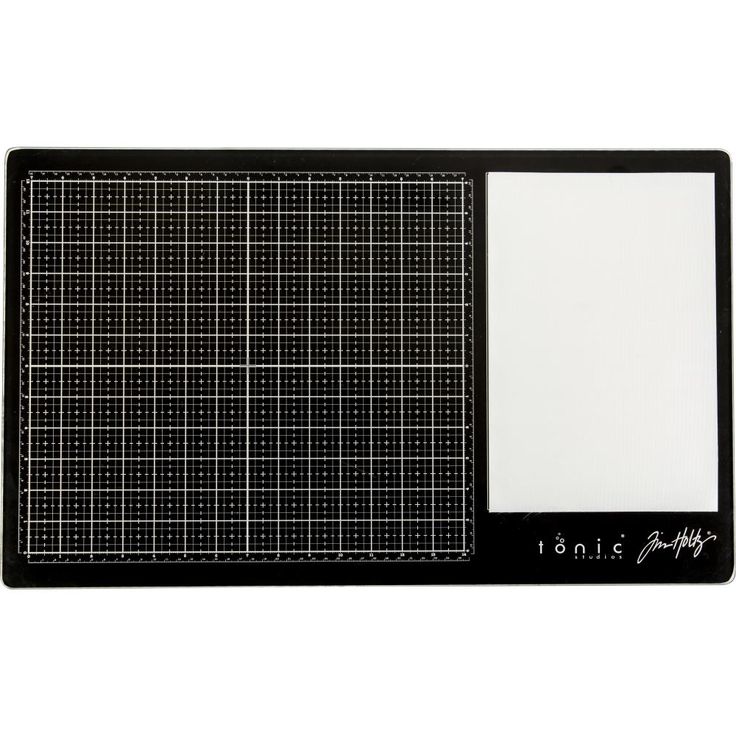 a black and white cutting board with a grid pattern on the front, and a blank sheet in the back