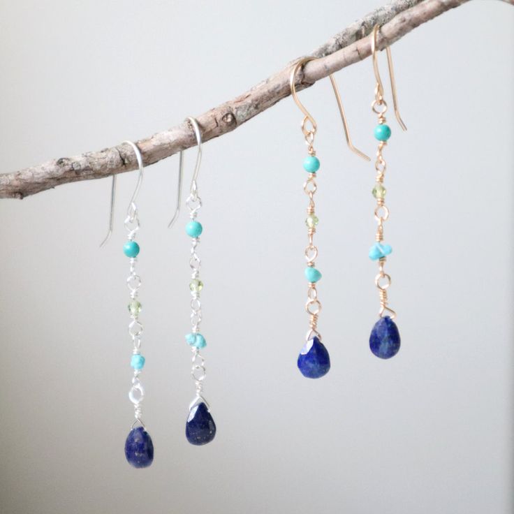 Dive into elegance with these stunning saltwater earrings, showcasing a harmonious blend of lapis, turquoise, and peridot gemstones that beautifully mimic the colors of the ocean. These gorgeous dangles capture the essence of seaside charm, making them a perfect accessory to complement your style with a touch of marine allure. Available in sterling silver or 14k gold filled Lapis, turquoise and peridot gemstones 22g handmade ear wires Earring length: 1 5/8 inches Style tip: Pair with matching Sa Dainty Sterling Silver Earrings With Gemstone Accents, Blue Dangle Gemstone Jewelry, Blue Gemstone Dangle Jewelry, Blue Briolette Sterling Silver Jewelry, Blue Sterling Silver Briolette Jewelry, Turquoise Dangle Jewelry Birthstone, Turquoise Dangle Birthstone Jewelry, Turquoise Birthstone Dangle Jewelry, Dainty Blue Birthstone Earrings