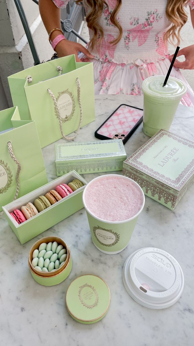 a table topped with green boxes filled with candy