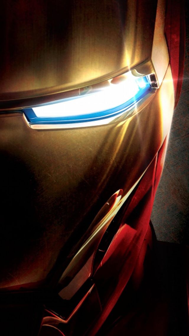 the iron man mask is glowing in the dark with light coming from it's eyes