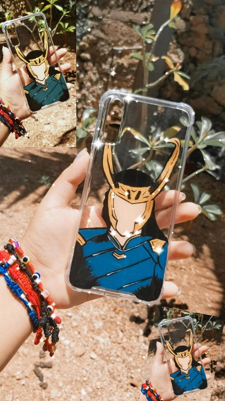 a hand holding up a phone case with an image of a man on it