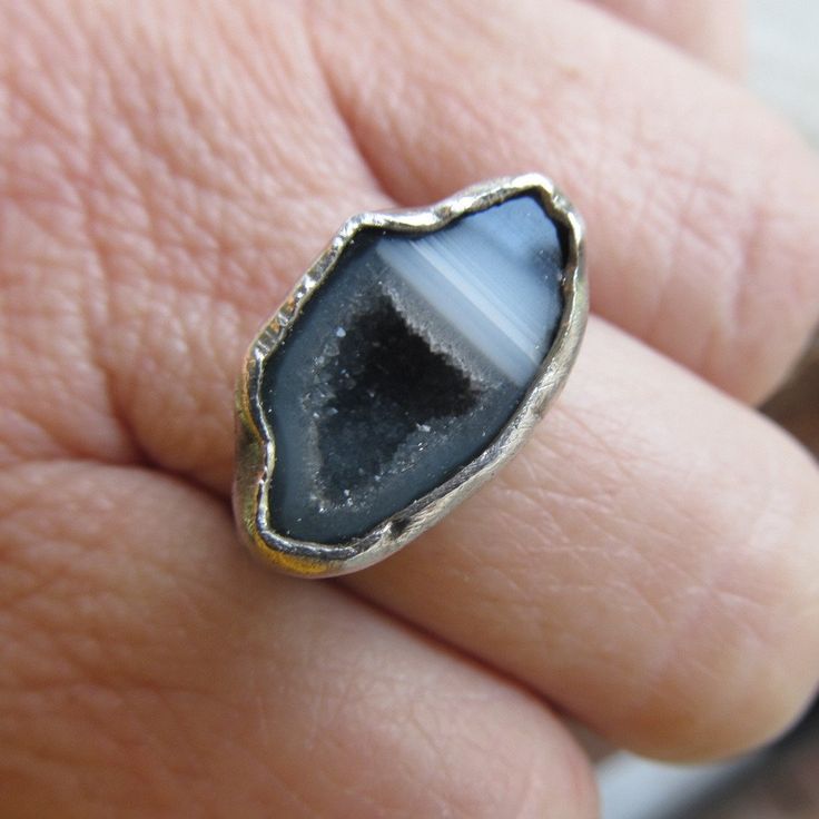 "Silver Mini Geode Ring Gray Druzy Ring Sparkly Druse Gemstone Ring: A stunning, one-of-a-kind, handmade stackable ring featuring a natural sparkling druzy geode set in sterling silver. The geode is gray and white and it measures 11/16\" by 7/16\". Band is 1/16\" wide. The ring itself is a size 6. Completely handmade by myself in sterling silver. Enter my shop: https://www.etsy.com/shop/artdi Join me on Facebook: https://www.facebook.com/Artdi-Diana-Anton-Jewelry-Design-44805607932/ Find me on I Artisan Rings With Natural Stones For Gift, Artisan Gemstone Promise Rings, Artisan Crystal Gemstone Ring, Artisan Open Ring With Natural Stones, Adjustable Stackable Rings With Natural Stones, Artisan Open Ring Gemstone Jewelry, Toe Ring With Natural Stones For Gift, Spiritual Open Ring With Natural Stones, Adjustable Natural Stone Rings For Anniversary