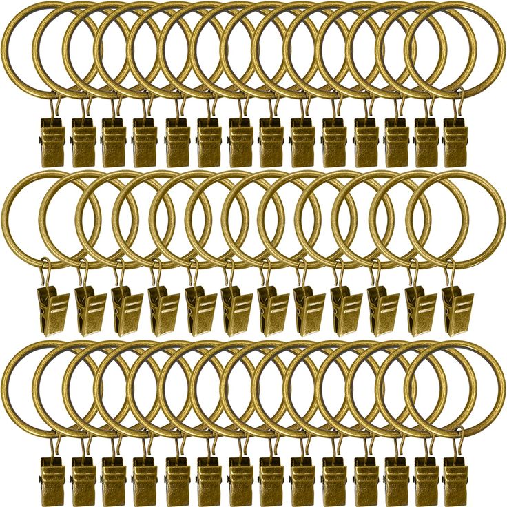 a bunch of brass rings and locks on a white background with clippings attached to them