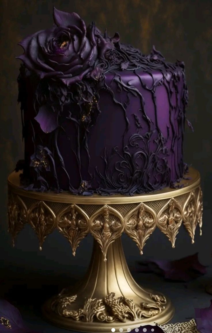 a purple cake sitting on top of a gold plate