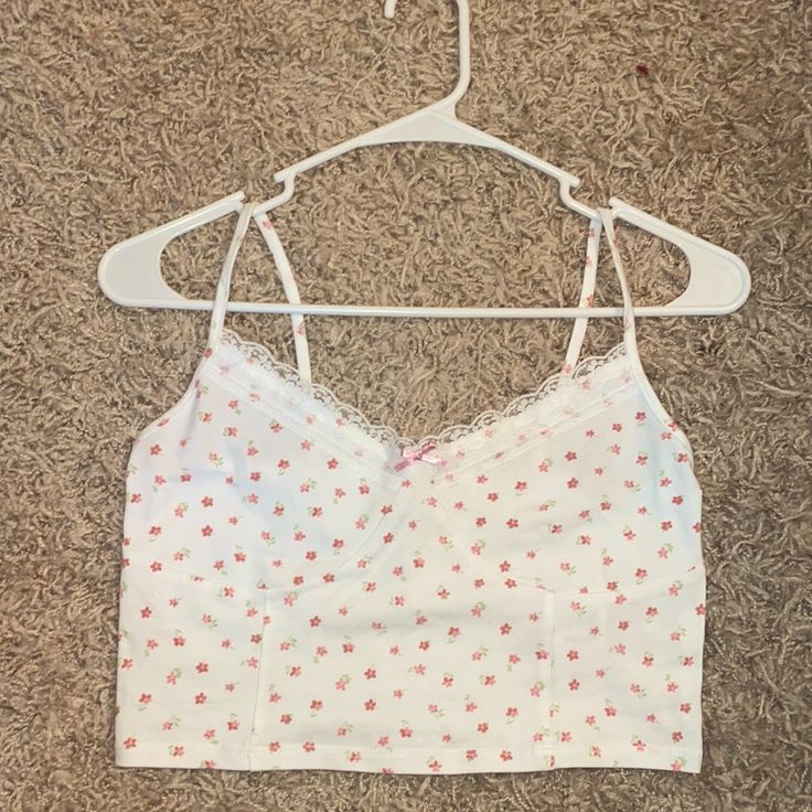 This Product Is From Pacsun. It’s A Medium, White, Cropped Tank Top With Pink Flowers. New With Tags! White Summer Beach Camisole, Cute White Tank Top With Floral Print, White Tank Tops For Summer, White Floral Print Cropped Crop Top, White Trendy Camisole For Spring, White Trendy Camisole For The Beach, White Floral Print Crop Top, Trendy White Camisole For Beach, Trendy White Camisole For The Beach