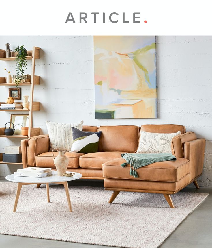 a living room filled with furniture and decor