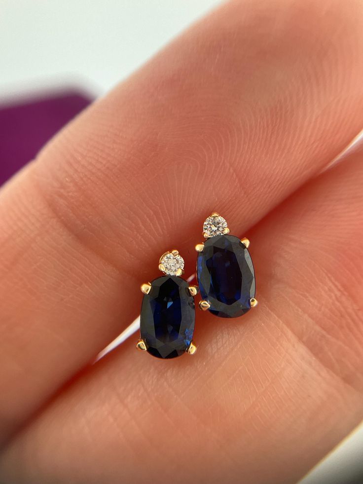 Welcome to Caviar and Cobwebs, thanks for stopping by ! Enjoy browsing.  Vintage 14k natural sapphire and diamond stud earrings. Stunning deep blue hue. The diamonds add a touch of glamour. Beautiful dainty earrings , the perfect addition to any collection. Great for someone with a September birthday. 1ct Sapphire total.  ** Measurements -  8mm x 4.3mm **  Gift wrapped and shipped safely from Canada.  Box in photos not included Oval Sapphire Diamond Earrings For Anniversary, Sapphire Diamond Earrings With Diamond Accents As A Gift, Sapphire Diamond Earrings With Accents As Gift, Oval Sapphire Earrings With Diamond Accents, Sapphire Earrings With Diamond Accents For Gift, Sapphire Earrings With Diamond Accents As Gift, Gift Sapphire Diamond Earrings, Anniversary Sapphire Earrings With Vvs Clarity, Sapphire Earrings With Diamond Accents For Anniversary