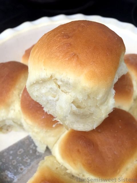 some rolls are on a plate with a spatula