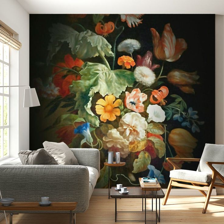 a living room filled with furniture and a painting on the wall