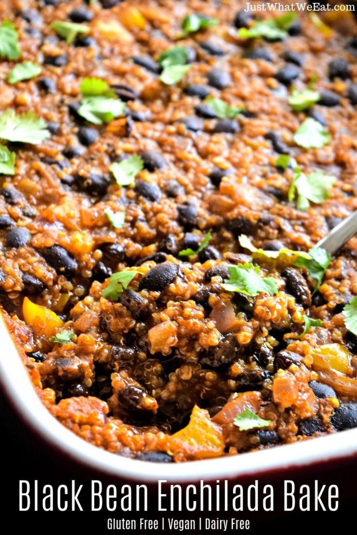 a casserole dish with beans, rice and cilantro