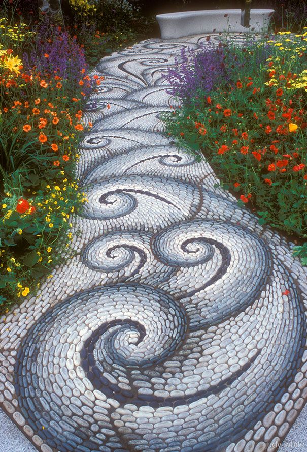 several different pictures of stone walkways with flowers and plants in the middle one is made out of cobblestones