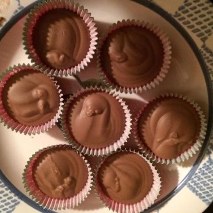 chocolates with peanut butter in the middle on a plate