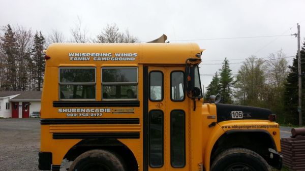 a yellow school bus parked in a parking lot