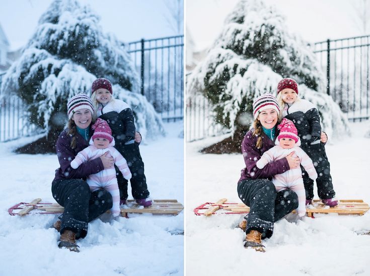 three children are sitting in the snow on sleds with their mom and dad