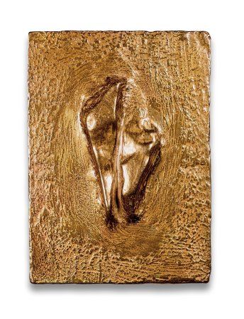 a square wooden plaque with an image of a woman's face on the surface