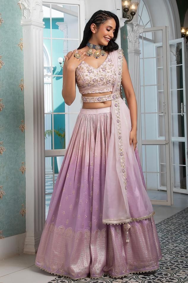 Pink, lavender attached cancan with floral woven motifs. Paired with V neck padded blouse, dupatta and belt.
Components: 4
Pattern: Woven, Embroidery
Type Of Work: Floral
Neckline: V neck
Sleeve Type: Sleeveless
Fabric: Organza
Color: Pink,Purple
Other Details: 
Lehenga Length: 43 inches
Lehenga Weight: 7 kg
Tassel bordered dupatta
Occasion: Destination Wedding - Aza Fashions Ombre Lehenga, Woven Embroidery, Padded Blouse, Pink Lavender, Fashion App, Set For Women, Aza Fashion, Sleeve Type, Lehenga