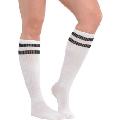 Pull on our White Stripe Athletic Knee-High Socks for some instant team spirit! These athletic knee-high socks feature allover bright white with two black stripes at the top. They reach all the way up to your knees for a look that's both sexy and demure! White Stripe Athletic Knee-High Socks product details:  Each measures 19in long Fits men's shoe sizes 4 1-2 to 7 1-2 and women's shoe sizes 5 1-2 to 9 1-2  52% acrylic 39% polyester 6% rubber 2% spandex 1% other fiber  Hand wash cold line dry Casual White Breathable Knee-high Socks, Sporty Knee-high Cotton Socks, Sporty Stretch Knee-high Hosiery, Breathable Casual Knee-high Sports Socks, Casual Breathable Knee-high Sports Socks, Casual Breathable Knee-high Socks For Sports, Sporty White Knee-high Hosiery, Breathable Casual Knee-high Socks For Sports, Casual White Knee-high Socks