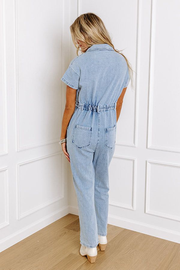 Jump into trendy style with this denim jumpsuit! Unlined denim material - A collared v-cut neckline that goes into a button-up bodice - Short sleeves - A functional chest pocket - A waistline with an elastic back, belt loops, a hidden zip fly, and button closure - Functional side and back pockets - A relaxed silhouette that ends in ankle length hemlines Denim Material, Trendy Style, V Cut, Denim Jumpsuit, V Cuts, Chest Pocket, Ankle Length, Trendy Fashion, Bodice