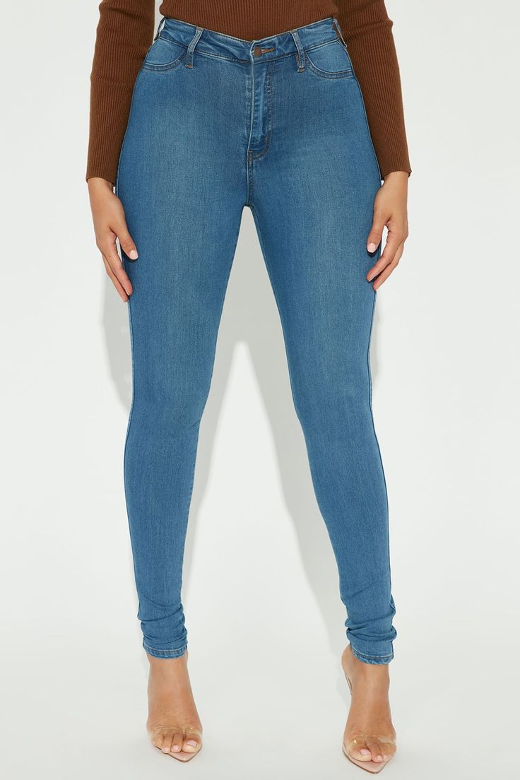 Say hi to your waist as you slip into our best-selling flexible stretch denim pants. The Classic High Waist Skinny Jeans feature a dark wash, 2 back pockets, 2 faux front pockets, a zip fly closure, and are available in Curve. Providing a seamless transition from day to night, these jeans are a wardrobe essential. Available In Multiple Washes Available in Petite 28" Inseam, Regular 31" Inseam, & Tall 34" Inseam 11" High Rise Skinny Jean High Stretch Faux Front Pockets Functional Back Pockets Dis Flattering Outfits, Stretch Denim Pants, Curve Jeans, Seamless Transition, Womens Loungewear, Night In, High Jeans, Active Wear For Women, Medium Blue