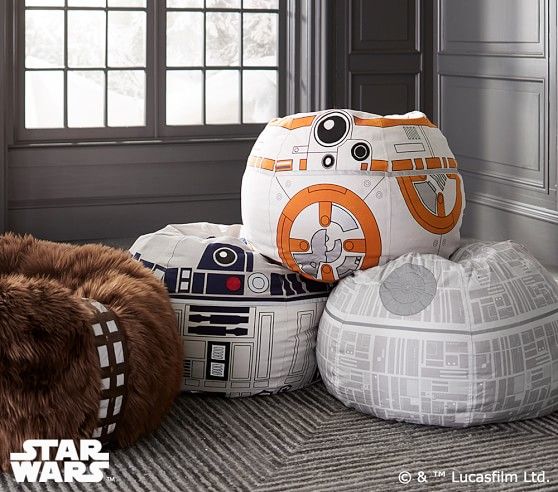 star wars themed pillows and bean bags on the floor