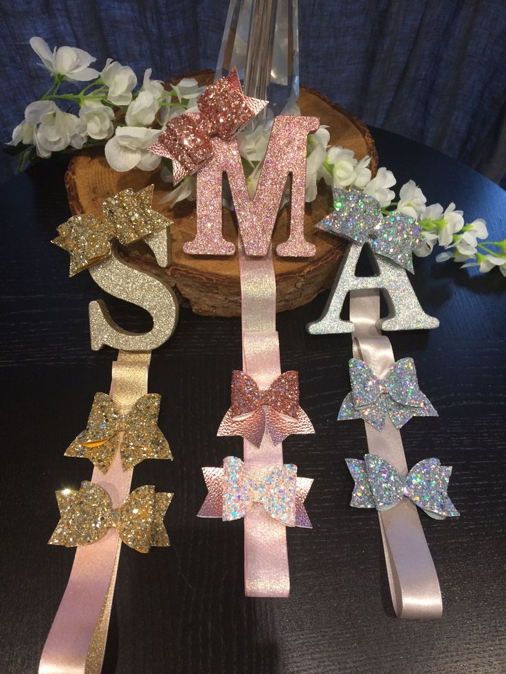 the letters are made out of glitter ribbons