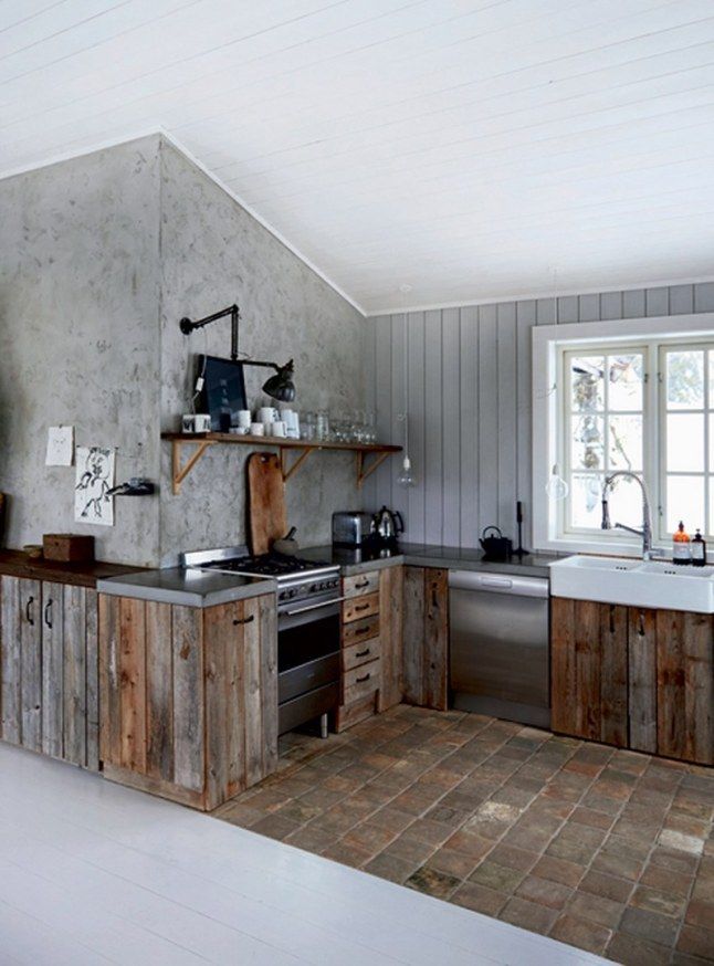 a kitchen with an oven, sink, and counter top in it's center