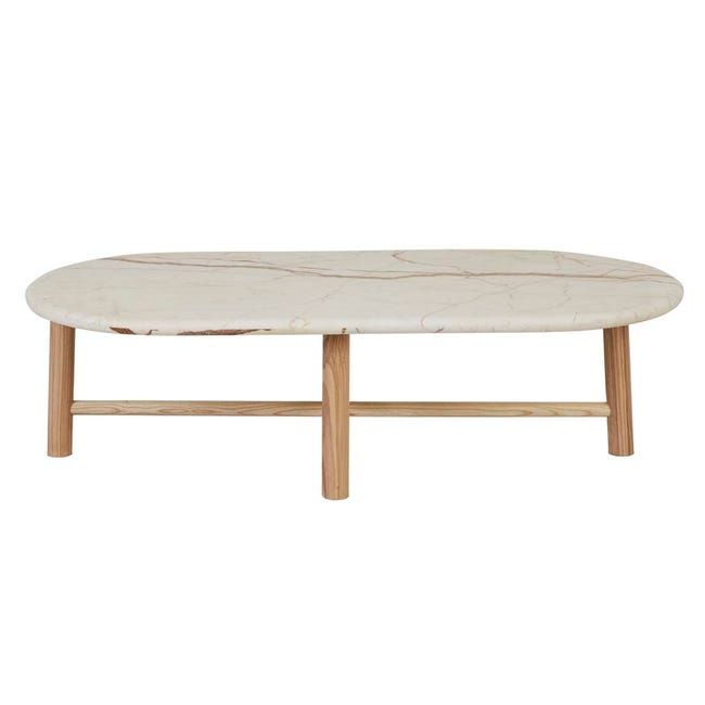 a white marble coffee table with wooden legs and an oval shaped top, against a white background