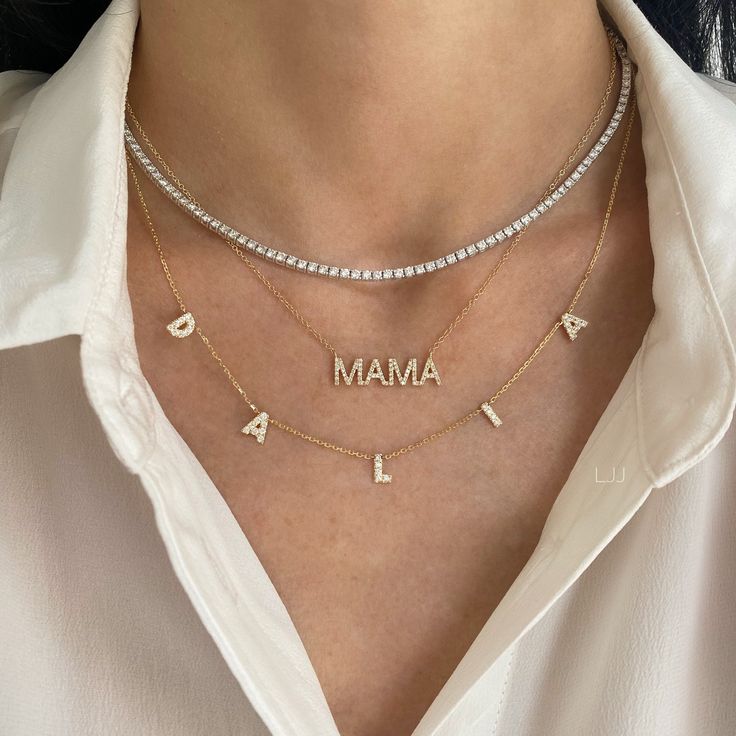 This beautiful necklace features the name/word of your choice in diamonds! Price is based per letter (number of characters). Regular spacing: letters will be 1/2" apart. Spaced out: letters will be 1" apart. (like CHLOE example shown) Example shown in the image is 5 characters total. We will not process your order unless the correct amount of characters has been selected. Available in 14K Yellow Gold, 14K White Gold, or 14K Rose Gold Letter Measurement: Approx. 1/4" (varies slightly per letter) Tennis Necklace Layered, Necklace Name Design, Diamond Chain Necklace, Jewelry Photos, Diamond Tennis Necklace, White Gold Chain, Fake Jewelry, White Gold Chains, Necklace Diamond