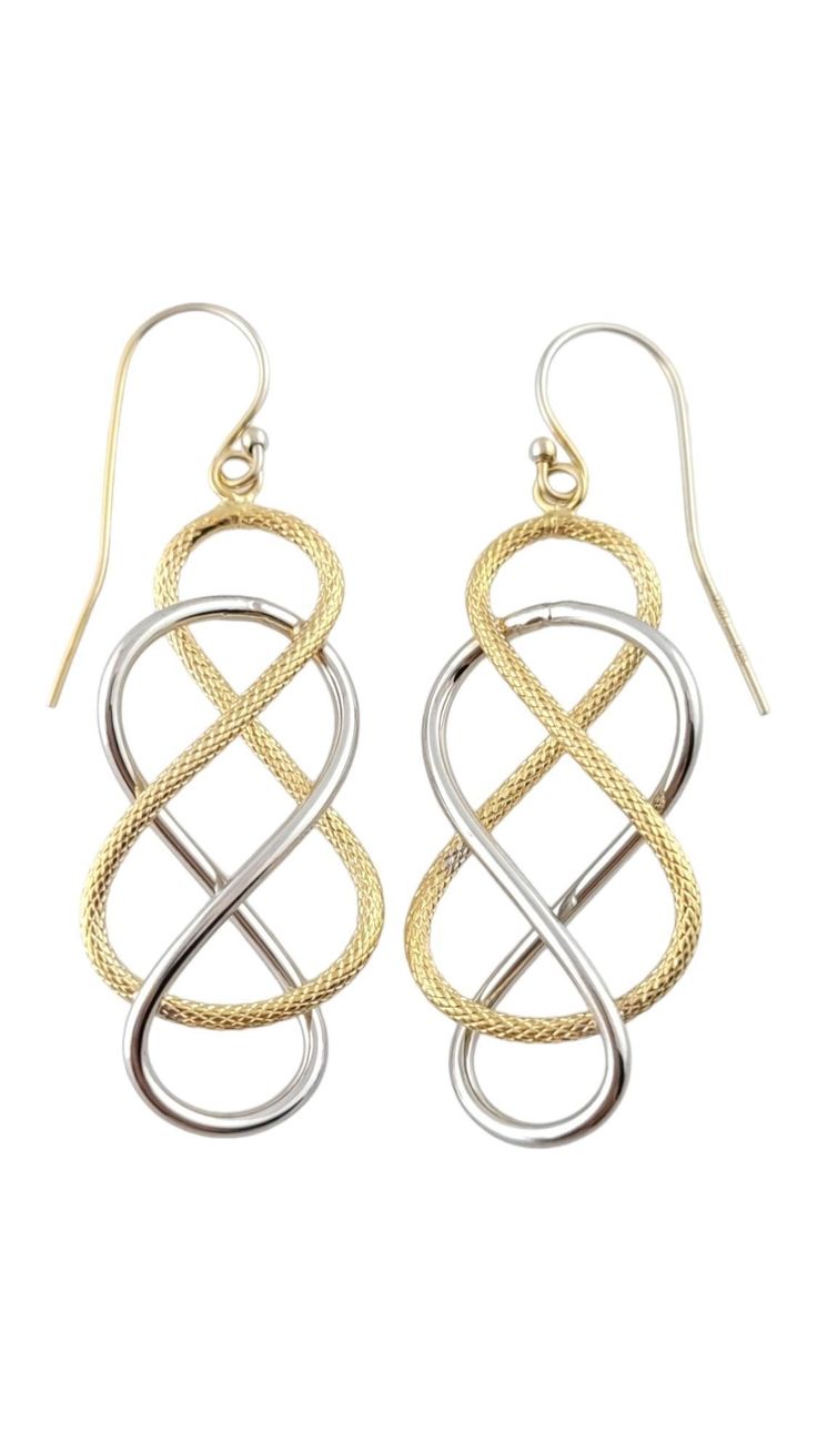 14K Yellow & White Gold Knot Braided Drop Earrings This gorgeous set of knot braided drop earrings were meticulously crafted from 14K white gold with a smooth finish as well as 14K yellow gold with a textured finish! Size: 50.25mm X 17.58mm X 5.81mm Weight: 1.54 dwt/ 2.39 g Hallmark: 14KT ITALY Very good condition, professionally polished. Will come packaged in a gift box or pouch (when possible) and will be shipped U.S. Priority Mail Insured. MM07092024/17KCS Elegant Yellow Gold Jewelry With Interwoven Design, Gold Knot Earrings, Yellow Gold Drop Earrings, Knot Braid, Statement Drop Earrings, Knot Earrings, Gold Halo, White Gold Earrings, Modern Earrings