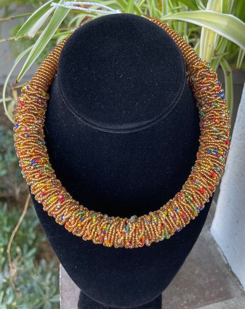 The Akuleau beaded choker style necklace is a choker style with solid color beads and colorful embellishment. Very lightweight and colorful. Ladies of Baskets and Beads in Kenya modeling many of the necklaces. Note: beaded embellishment may be slightly different than pictured. Rope Jewelry, Choker Style Necklace, Beaded Rope, Color Beads, In Construction, Choker Style, Style Necklace, Beaded Choker, Kenya