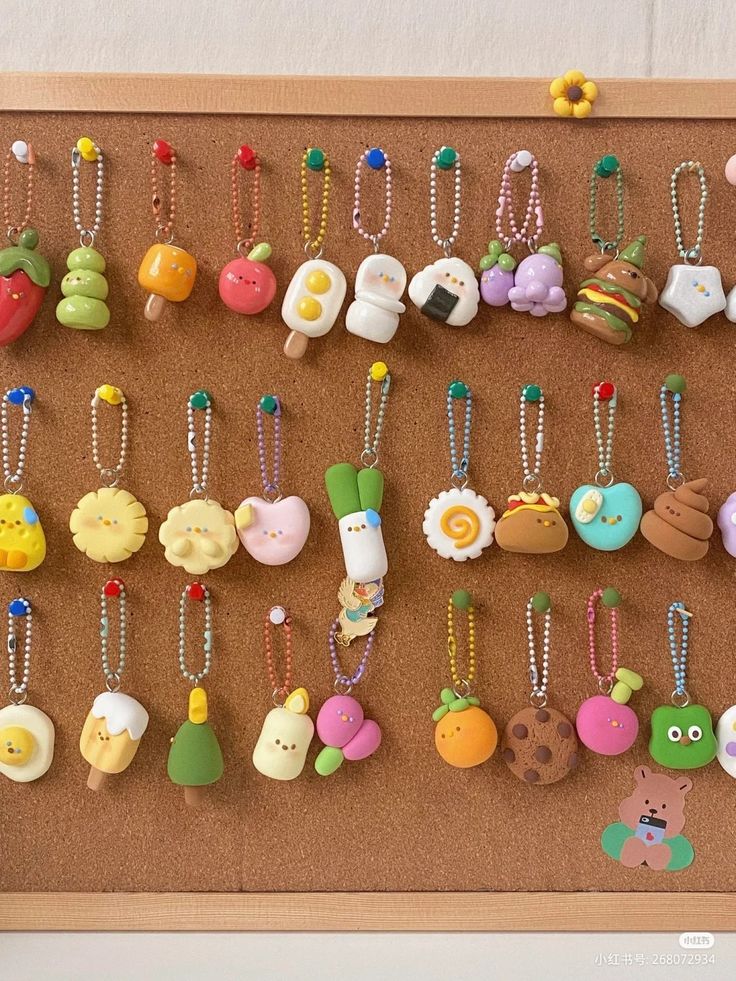 a cork board with many different types of buttons attached to the pegs on it