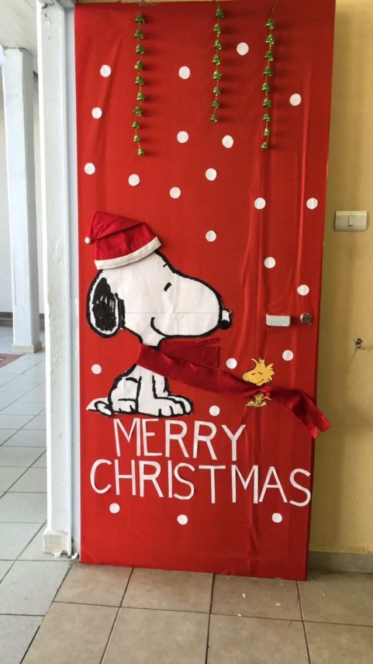 a door decorated with a snoopy christmas decoration